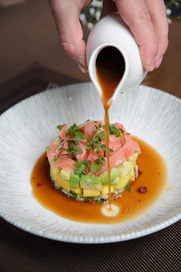 Royal Tulip Hotel & Casino, Tbilisi Ngoại thất bức ảnh Soy sauce being drizzled over a sushi dish