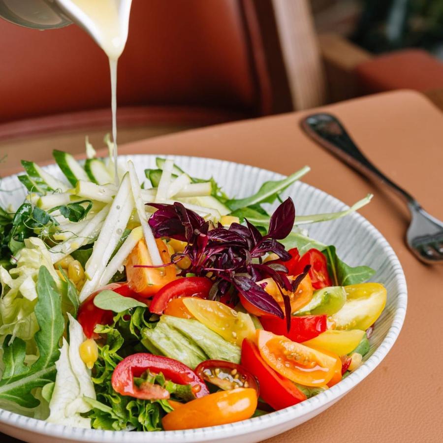 Royal Tulip Hotel & Casino, Tbilisi Ngoại thất bức ảnh A salad being drizzled with a vinaigrette